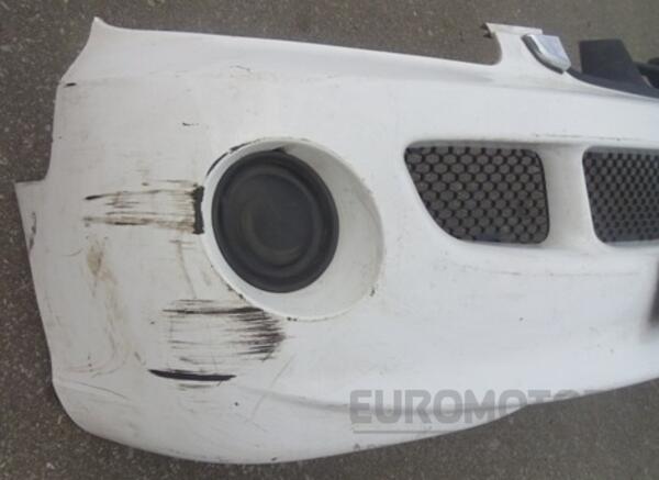 Бампер передній в зборі з гратами 00- Hyundai H1 1997-2007 865104A000 7199 - 2